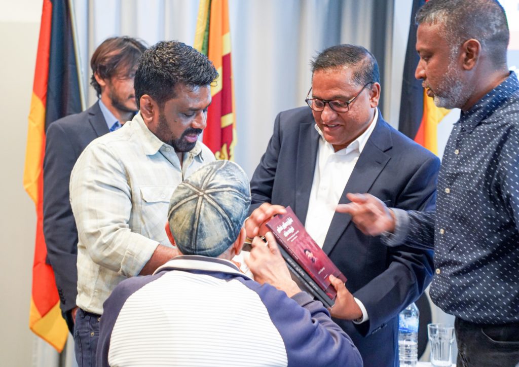 Vijitha Herath and President Anura Kumara gifted a book bundle