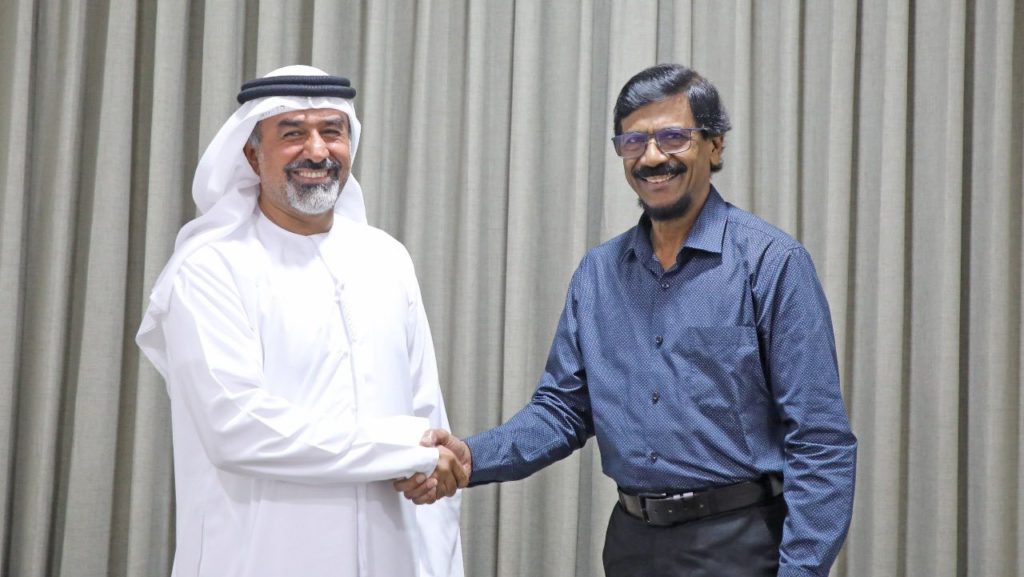 Tilvin Silva Handshake with KHALED NASSER SULAIMAN NASEER ALAMERI